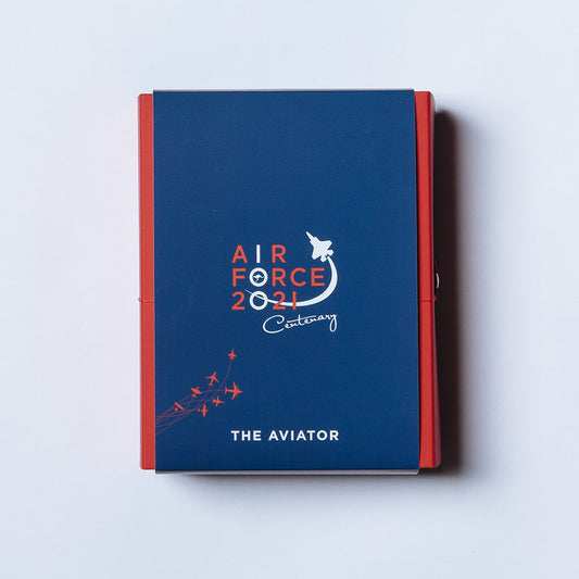 Photo of red and blue packaging of Australian made watch Aviator Mk II with Air Force 100 Centenary logo